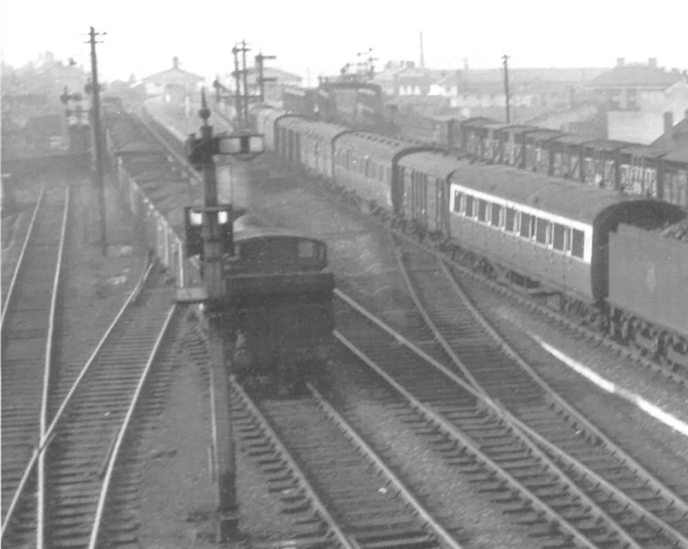 Close up showing an ex-GWR 0-6-0PT Pannier tank marshalling a long coal train as it prepares to set back to Bordesley sidings