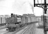Ex-GWR 0-6-0PT No 3673, a class 51xx locomotive, is seen at the head of a freight passing under the former Midland line to Camp Hill