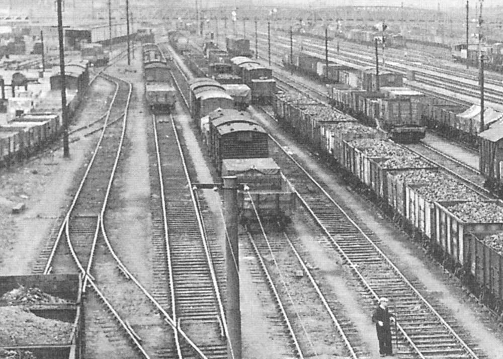 Close up showing the arrival sidings on the left of Bordesley yard with a mix of full open top wagons and vans in evidence