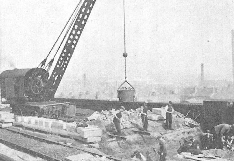 A six ton steam crane removes the old brickwork from the subsidiary arches during the partial reconstruction of Bordesley Viaduct in 1939