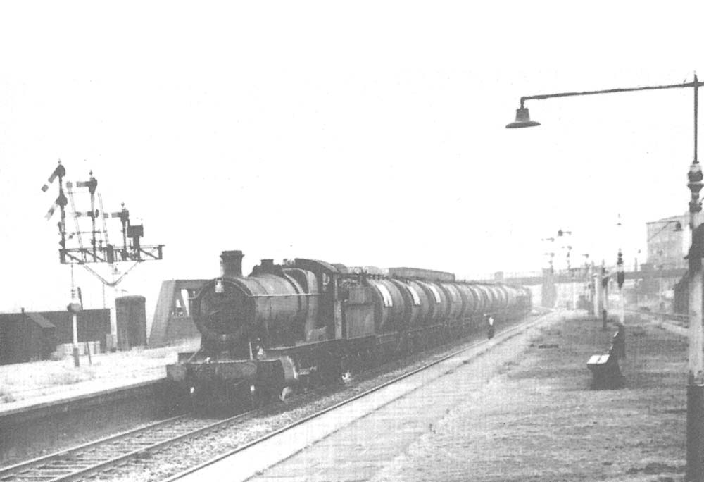 Ex-GWR class 38XX 2-8-0 No 3864 with a block oil train on the Down Main Line at the southern end of Bordesley Station in 1965