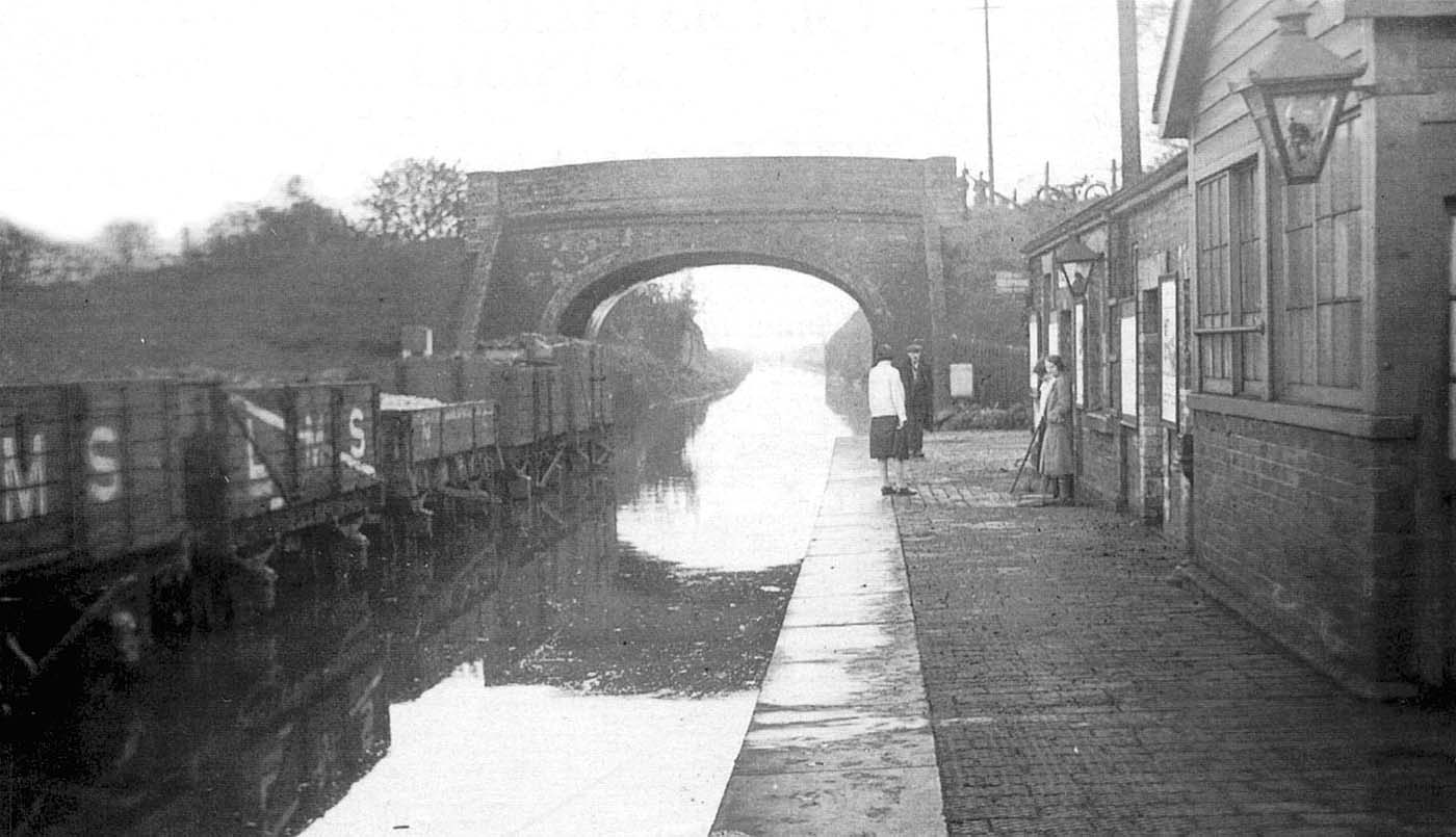 Claverdon station looks more like a canal than a railway following the Whitsun Floods in 1932