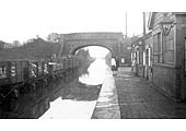 Claverdon station looks more like a canal than a railway following the Whitsun Floods in 1932