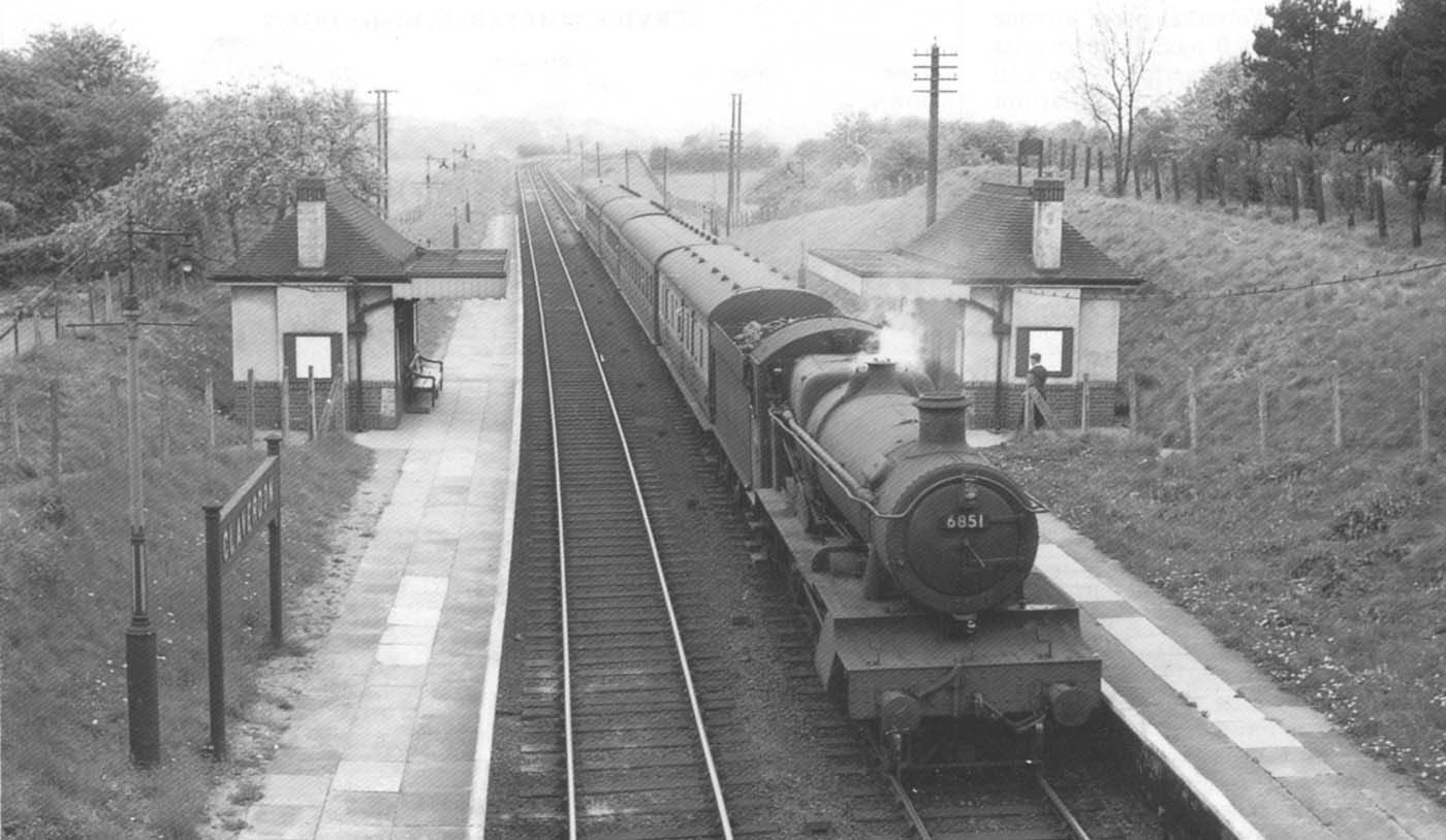 Viewed from the footbridge GWR 4-6-0 No 6851 Hurst Grange starts away from Claverdon for Leamington