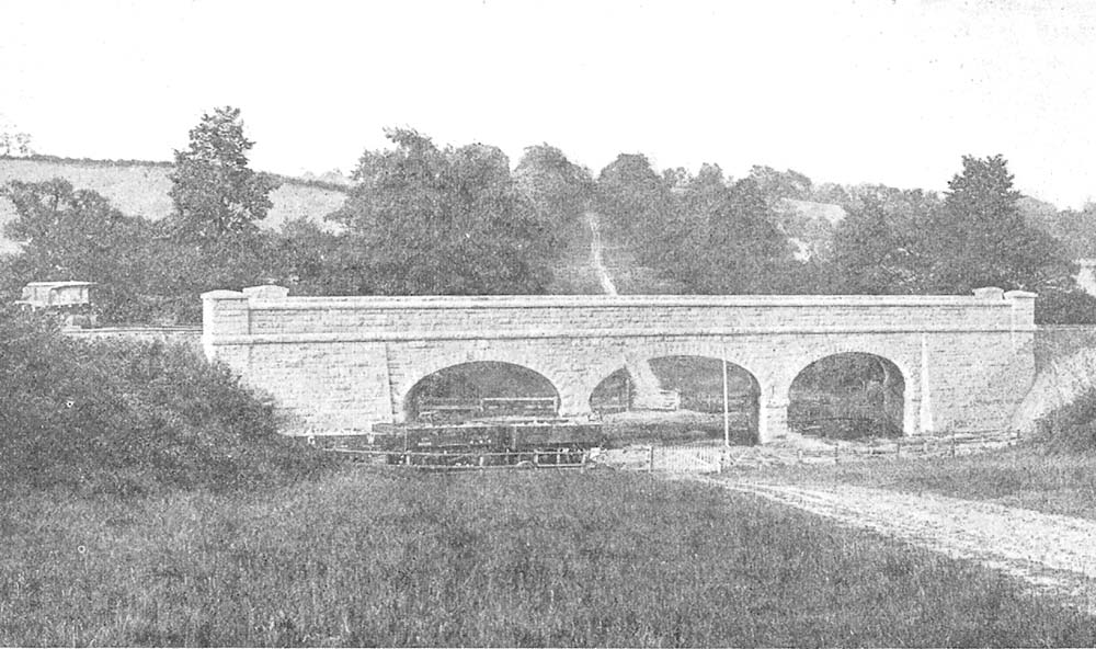 In this view of Umberslade bridge the driveway is closed off by a timber vertical slatted gate and there are both temporary wagons and GWR wagons evident