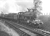 GWR 4-6-0 Saint class No 2903 'Lady of Lyons' is seen at the head of an up express service comprised primarily of clerestory coaching stock