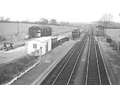 An elevated view from the passenger footbridge looking  towards Birmingham and showing the goods yard on the left and the signal box on the right