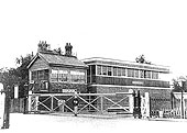 The original 1891 signalbox stands sandwiched between the gates controlling Evesham Rd and its replacement