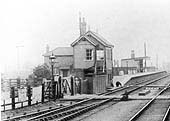 Close up showing the original signal box and the level crossing