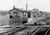 Close up  showing the booking office, timber framed store and grounded coach body on the up platform