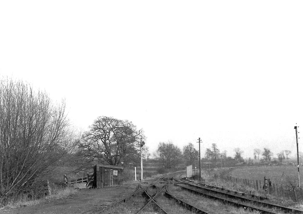 Looking towards Spencer's level crossing at the Bearley end of Great Alne goods yard with the gatekeepers cottage around the bend in the distance