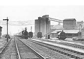 Ex-GWR 4-6-0 Hall class No 4954 �Plaish Hall� hauls an express past the Harbury Cement Works in April 1958