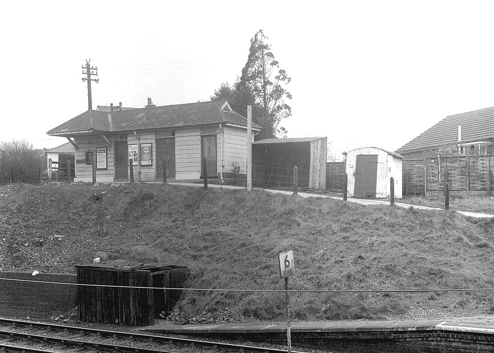Looking across the two lines towards the building accommodating the Booking Office and the cycle rack to its right