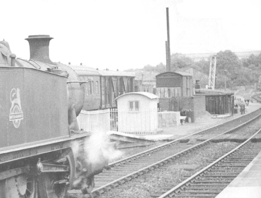 Close up showing the end of the up platform and part of the station's goods yard and lineside structures
