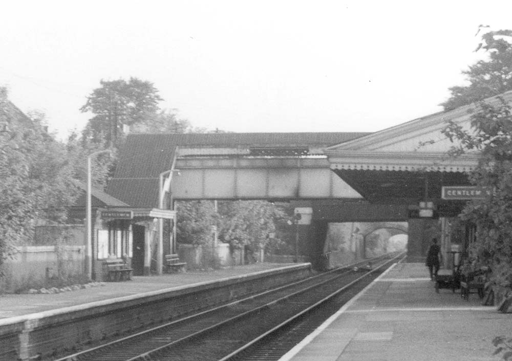 Close up showing Hall Green's starter signal silhouetted against the road bridge with a sighting board created by painting the brickwork white