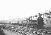 An unidentified GWR 0-6-0 Goods locomotive is seen passing Handsworth Junction Signal Box whilst at the head of long goods train