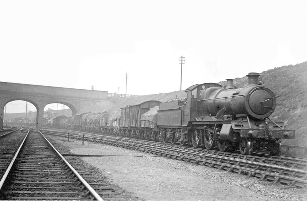 GWR 43xx Class 2-6-0 No 4312 is seen passing Handsworth Junction on the up fast at the head of a long goods train