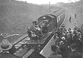 The GWR 2-6-2T locomotive arrives at the new Halt breaking a tape consisting of the two teams club colours