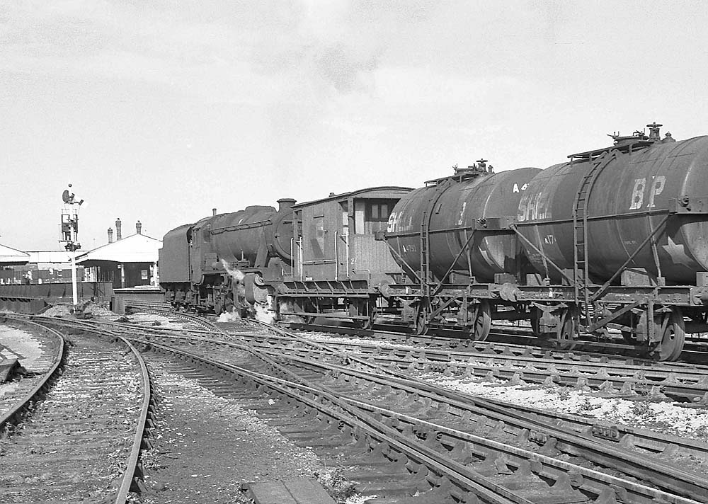 Ex-LMS 8F 2-8-0 No 48312 is seen running tender first through Handsworth and Smethwick station on 26th September 1964
