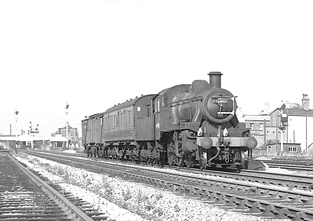 BR built 2MT 2-6-0 No 46492 passes through Handsworth and Smethwick station on 26th September 1964