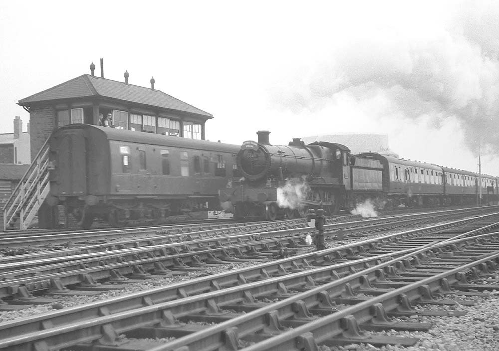 Ex-GWR 4-6-0 No 6849 'Walton Grange' is seen standing at Handsworth and Smethwick signal box whilst working a Ffestiniog Society Special on 1st May 1965