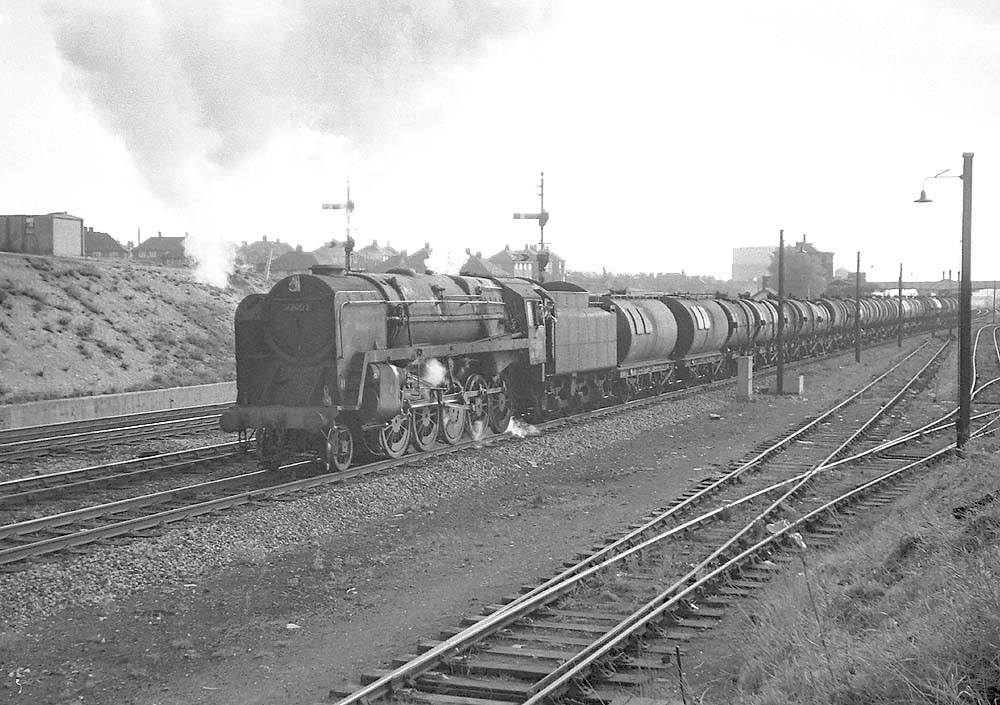 British Railways Standard Class 9F 2-10-0 No 92002 passes through Handsworth with oil train on 26th September 1964