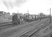 British Railways Standard Class 9F 2-10-0 No 92002 passes through Handsworth with oil train on 26th September 1964