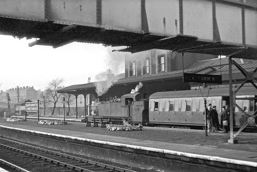 Ex-GWR 2-6-2T No 4140 stands with the 15:30 Snow Hill to Wolverhampton Low Level service on 19th March 1955