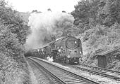 BR Standard Class 9F 2-10-0 No 92219 burst from Harbury tunnel on a mid morning southbound train of empty ore wagons