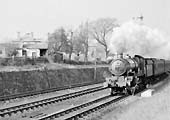 Ex-GWR 4-6-0 Castle Class No 5034 'Corfe Castle' is seen near Harbury on an express service on 9th February 1952