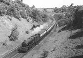 GWR 4-6-0 No 6024 'King Edward I' at the head of an express leaving Harbury Tunnel