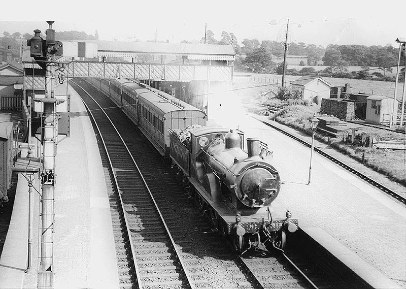 A view from the road bridge at the Birmingham end of the station with ex-LSWR T9 4-4-0 No 313 on a down Sunny Coast express train