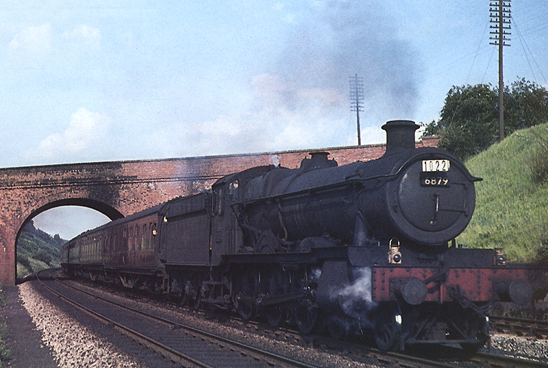 Ex-GWR 4-6-0 Grange class No 6879 'Overton Grange' is seen at the head of the Saturdays only Weymouth to Wolverhampton service on 20th June 1964