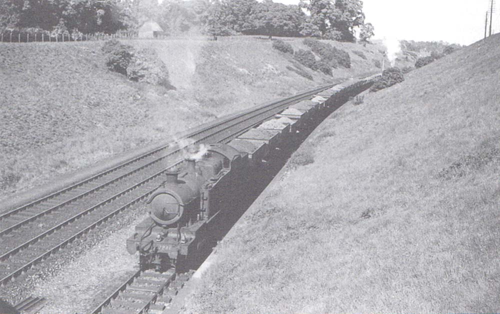 Ex-GWR 72xx Class 2-8-2T No 7246 receives assistance from a 2-6-2T banker as it climbs the down goods line