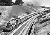 Ex-GWR 4073 Class 4-6-0 No 5025 'Criccieth Castle' is seen on a down Summer Saturday special in 1960