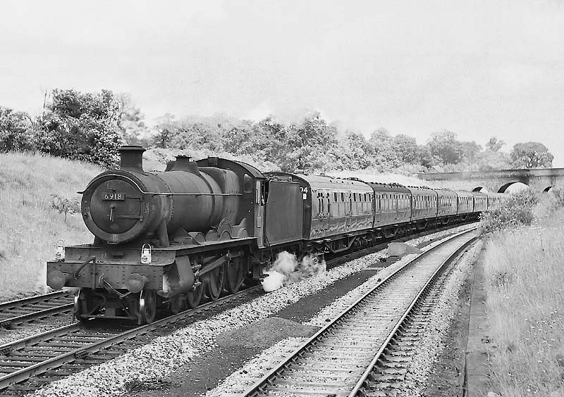 Ex-GWR 49xx Class 4-6-0 No 6918 'Sandon Hall' climbs Hatton Bank with the 9:40am Eastbourne to Wolverhampton express on 20th June 1964