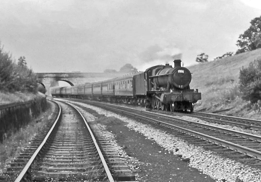 Ex-Great Western Railway 49xx Class 4-6-0 No 6933 'Birtles Hall' descends Hatton Bank with the 11:00 am Wolverhampton to Weymouth service on 8th August 1964