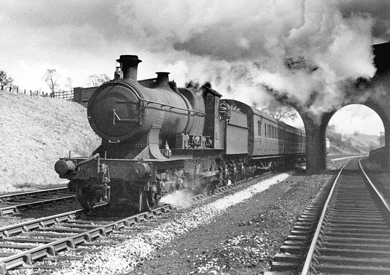 GWR 4-4-0 33xx  or Bulldog class No 3377 is seen climbing Hatton Bank approximately 1 mile east from Hatton on the down main line
