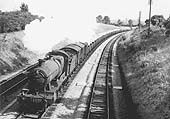 GWR 2884 class 2-8-0 No 3825 climbs Hatton bank on the down main line with a class C express freight on 7th September 1956