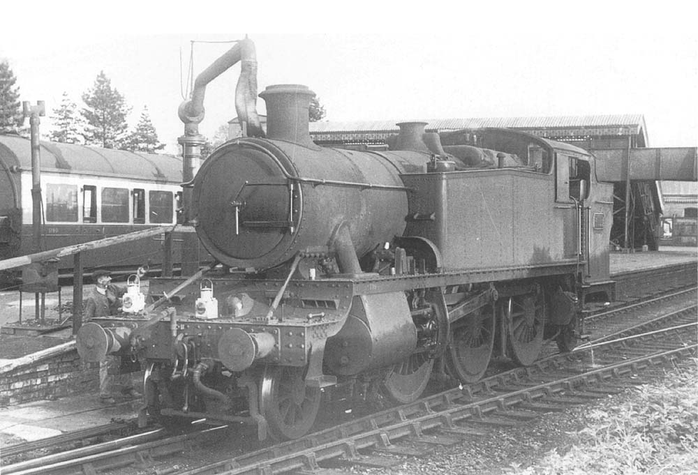 A closer view of the unidentified GWR 2-6-2T Class 41xx locomotive taking on water prior to taking forward a Henley-in-Arden to Moor Street local passenger service