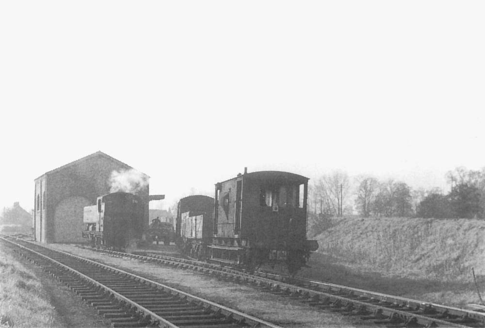 Ex-GWR 0-6-0PT 94xx class No 9432 is seen with its wagons rolling past, by gravity, into a parallel siding