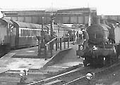 Close up of the up platform's water crane being used to fill an unidentified ex-GWR 2-6-2T Prairie locomotive with water