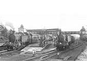 Two unidentified GWR 2-6-2T 41xx class tank engines are seen standing at Henley-in-Arden's up platforms