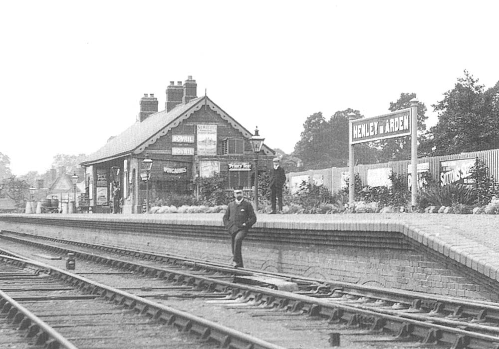 Close up showing the original Henley-in-Arden single-storey station building built using red brick and grey slate roof and the ornate platform front