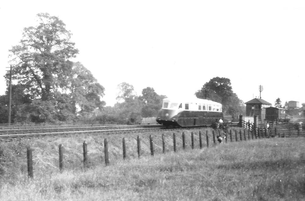 A GWR Diesel Railcar (thought to be Railcar No 2) crosses Bear Lane overbridge north of Henley-in-Arden Station