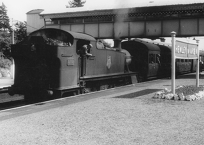 Ex-GWR 2-6-2T 5101 class Prairie No 8103 is seen arriving tender first at the station's up through platform with a service to Moor Street