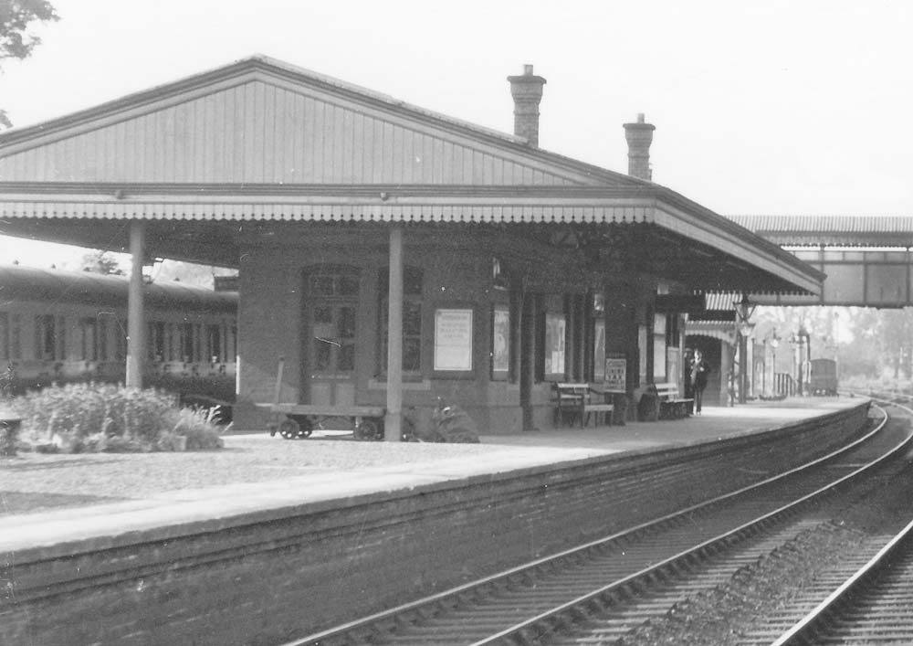 Close up showing the island platform's passenger facilities with the through up line on the right and on the left the up 'bay'