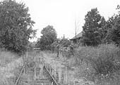 View of Henley-in-Arden's original station, now abandoned with weeds growing through the track, after closure of the goods facilities in 1964