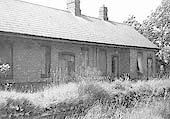 View of the front elevation of the original Henley-in-Arden station building and platform which are now seen in a derelict condition