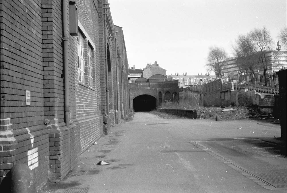 View from ground level of the tunnel which led under the railway to the passenger station circa 1971
